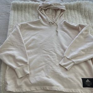 Womens cream colored hooded sweatshirt.
